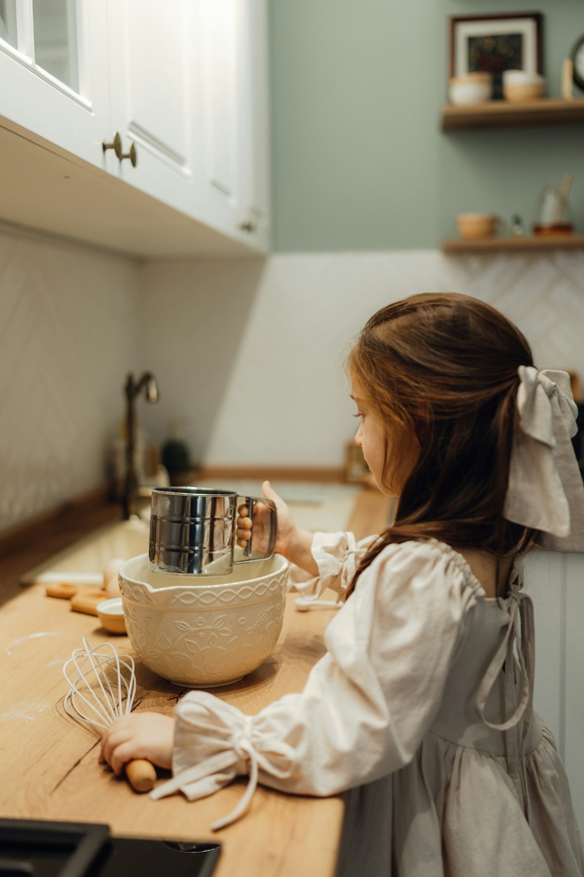 A little girl mixing something in a bowl