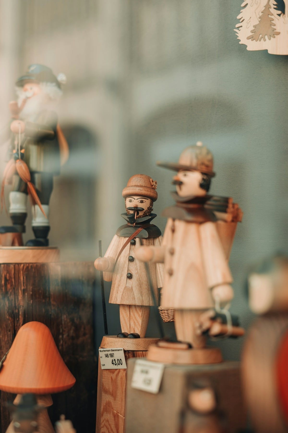 a group of wooden figurines sitting on top of a table