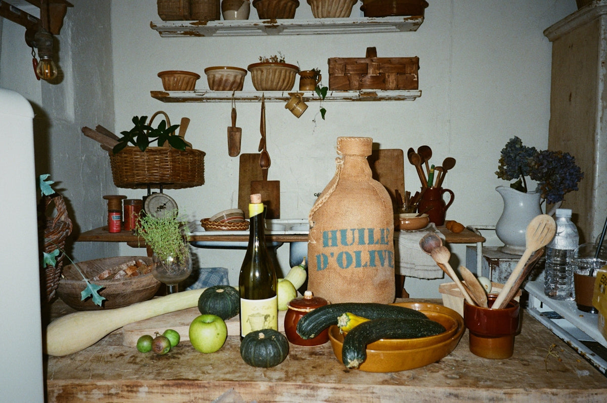 a kitchen counter topped with lots of food